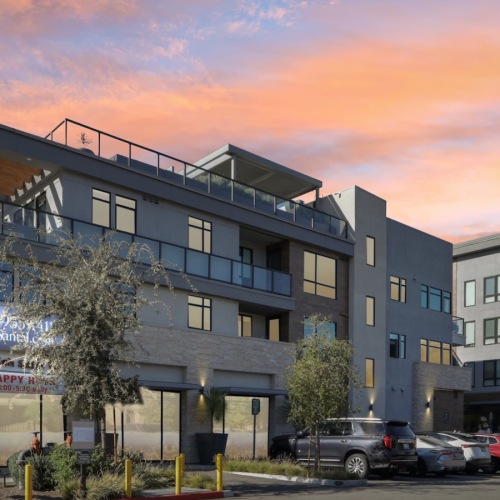 the exterior of a building at sunset