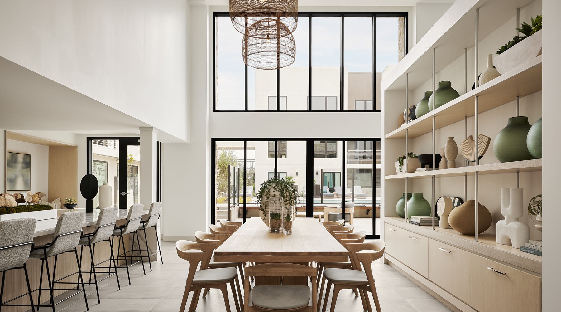 rendering of a bright resident lounge with modern tables, ample seatings and easy access to the pool