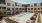 Studio Apartments in Thousand Oaks CA - Santal Thousand Oaks - Resort-Style Pool with Lounge Chairs, Tables, Spa, and Landscaping.